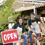 Workers in retail garden store open for business